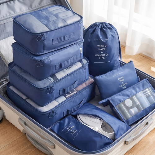 Open suitcase organised with colour-coded packing cubes