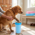 Person cleaning their dog's muddy paw in the paw cleaner cup after a walk