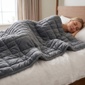 Person sleeping peacefully under the weighted blanket, easing anxiety