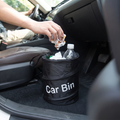 Person putting rubbish in the leakproof car trash can, tidy interior
