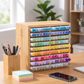 Tidy desk with stationery organised in a bamboo desktop organiser